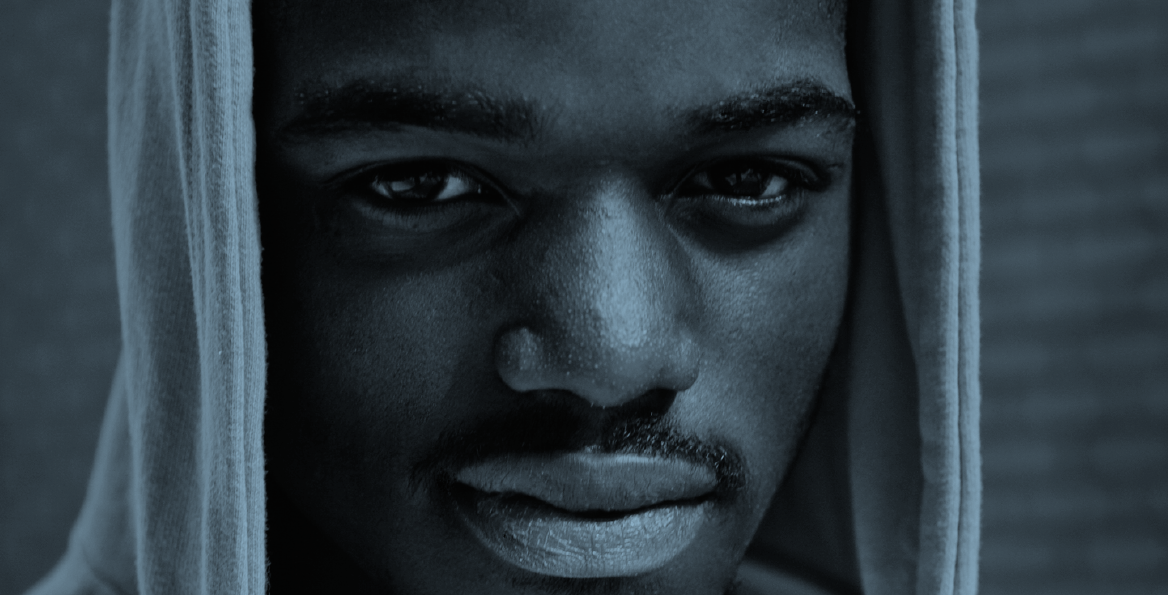 Image of a young Black man in a hoodie