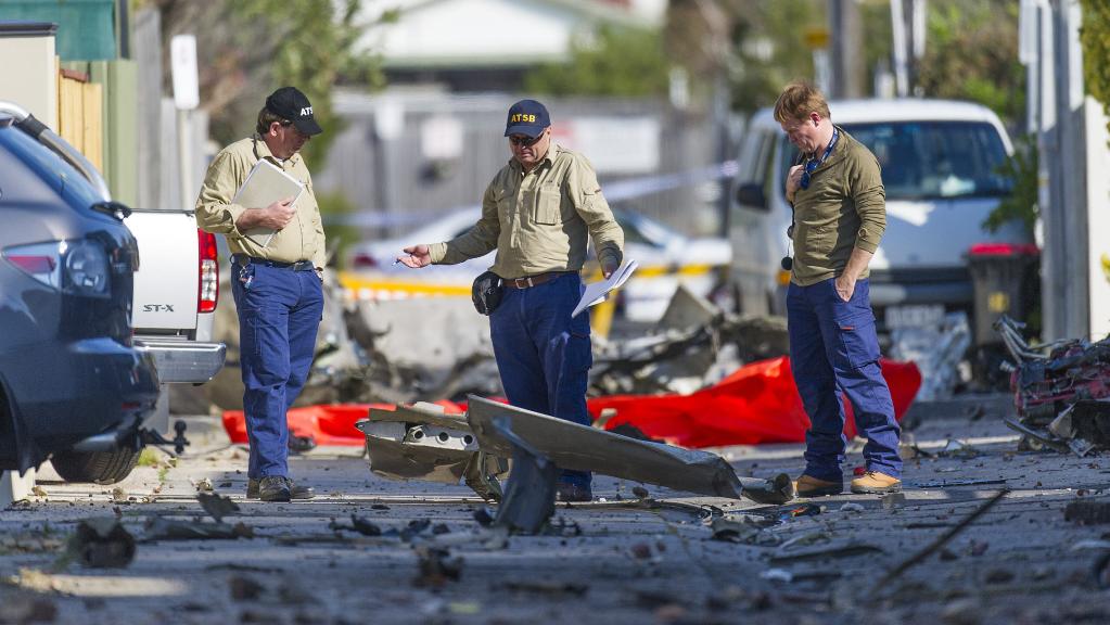 Australian Transport Safety Bureau investigators scour the wreckage of a light plane crash in Chelsea. Picture: Eugene Hyland